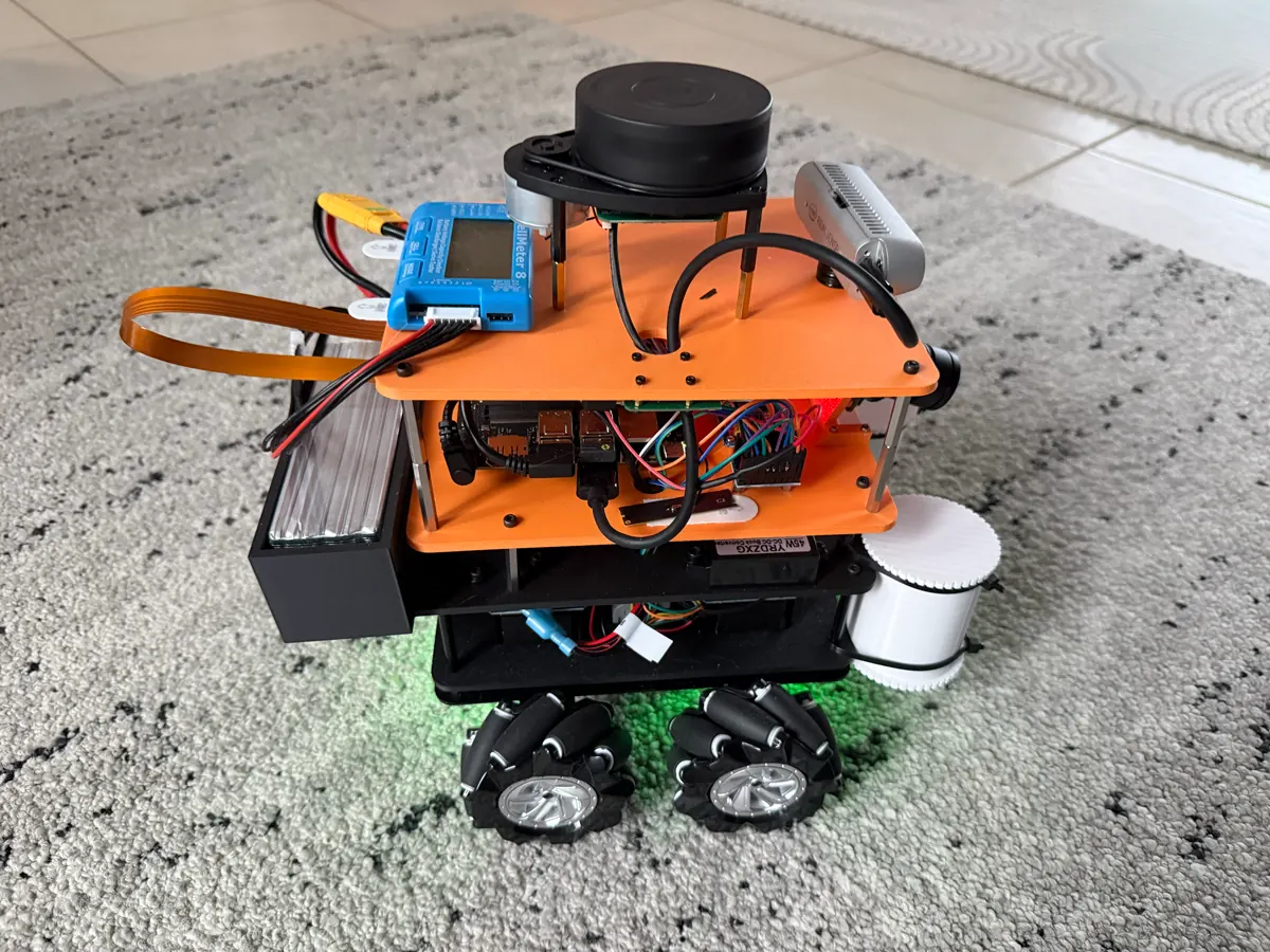 Project Ogre, an orange mecanum-wheel robot with a lidar on top